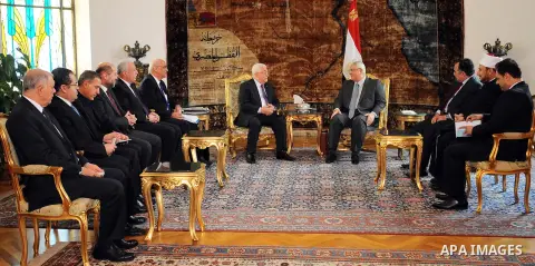 A handout picture released by Egyptian Presidency shows Palestinian President Mahmoud Abbas meets with Egyptian interim President Adly Mansour, in Cairo on April 09, 2014. Arab foreign ministers met with Abbas to discuss...