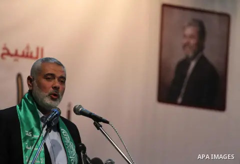 Palestinian Prime Minister in Gaza strip, Ismail Haniyeh, speaks in the school day during the anniversary of the departure of Sheikh Khalil Quqa in Gaza City, on April 10, 2014. Photo by Mohammed Asad