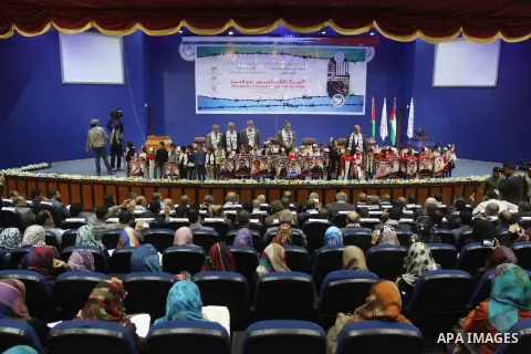 Palestinians attend a Scientific conference entitled the Palestinian Prisoners "Towards freedom" at Islamic University in Gaza city, on April 15, 2014. Photo by Mohammed Asad