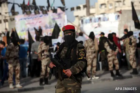 Palestinian Islamic Jihad militants take part in a rally marking Palestinian Prisoner's Day in the central Gaza Strip April 15, 2014. Photo by Ashraf Amra