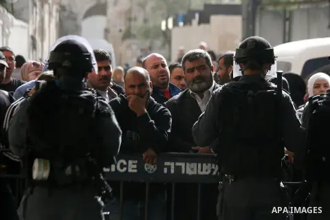 Israeli policemen prevent Palestinians from entering the Al-Aqsa mosque compound in the Old City of Jerusalem on April 16, 2014. Dozens of Palestinians were wounded in clashes with Israeli police that erupted when Jerusa...