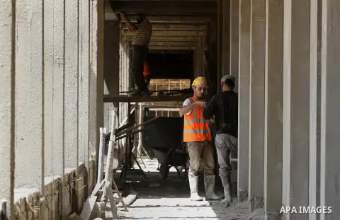 Palestinian labourers work at the construction site of Hamad City, in Khan Younis in the southern Gaza Strip, April 16, 2014. Qatar funds several large economic projects in Gaza Strip ruled by Hamas, with the total cost...