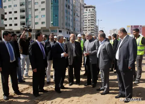 Palestinian Prime Minister in Gaza Strip Ismail Haniyeh, visits the construction site of al-Rasheed Road, in Gaza City, April 16, 2014. Qatar funds several large economic projects in Gaza Strip ruled by Hamas, with the t...