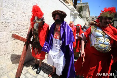 Christian Orthodox pilgrims participate in a procession marking Good Friday on April 18, 2014 in Jerusalem's old city. Thousands of Christian pilgrims take part in processions along the route where, according to traditio...