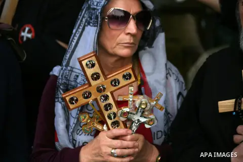 Christian Orthodox pilgrims participate in a procession marking Good Friday on April 18, 2014 in Jerusalem's old city. Thousands of Christian pilgrims take part in processions along the route where, according to traditio...