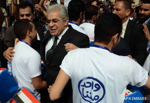 Egyptian presidential hopeful Hamdeen Sabahy waves to supporters as he arrives to formally submit the documents required for his presidential candidacy to Egyptian presidential elections commission, in Cairo, Egypt, 19 A...