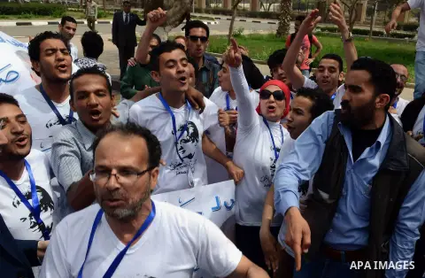 Campaign volunteers of presidential hopeful Hamdeen Sabahi, carry boxes containing thousands of endorsements at the election commission office in Cairo, Egypt, Saturday, April 19, 2014. It is mandatory for any presidenti...