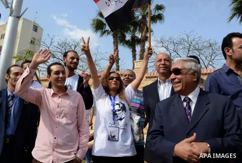 Egyptian presidential hopeful Hamdeen Sabahy waves to supporters as he arrives to formally submit the documents required for his presidential candidacy to Egyptian presidential elections commission, in Cairo, Egypt, 19 A...