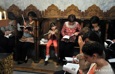 Palestinian Orthodox Christians celebrate Holy Fire ceremony at the Saint Porfirios church in Gaza City early Gaza City on April 20, 2014. Photo by Mohammed Talatene