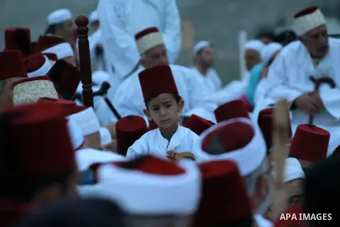 Members of the Samaritan sect perform the prayer in the Passover on Mount Gerizim, near the West Bank city of Nablus, on April 20, 2014. Samaritans have been present on the Land of Israel for over 2,500 years. Their reli...