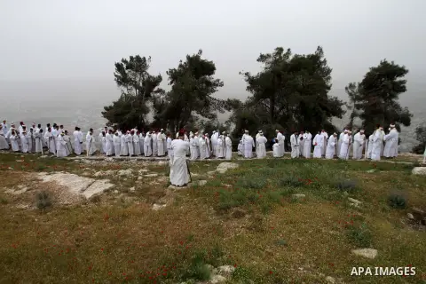 Members of the Samaritan sect perform the prayer in the Passover on Mount Gerizim, near the West Bank city of Nablus, on April 20, 2014. Samaritans have been present on the Land of Israel for over 2,500 years. Their reli...