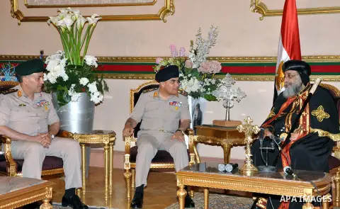 A handout picture released by the Egyptian armed forces shows Defence Minister Colonel General Sedki Sobhi, meets with Pope Tawadros II, pope of Egypt's Coptic Orthodox Church on April 20, 2014 at the Cathedral of Abbasi...