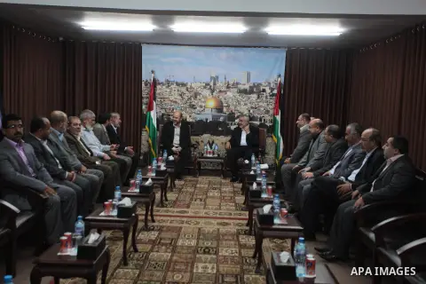 Palestinian Prime Minister in Gaza Strip, Ismail Haniyeh meets with senior Hamas leader Mousa Abu Marzouk, at his office in Gaza city on April 21, 2014. Abu Marzouk arrived at the Hamas-controlled Gaza Strip on Monday to...
