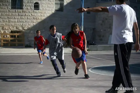 Palestinian girls attend a basketball training in Jerusalem's Old City, April 30, 2014. The team is the first women's team belonging to the sons of Jerusalem club, and consists of about 70 girl between the ages of 10 to...