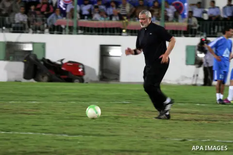 Palestinian Prime Minister in Gaza Strip Ismail Haniyeh participate in a football match at al-Yarmouk stadium, marking the Traffic Day, in Gaza City on May 5, 2014. Photo by Mohammed Asad