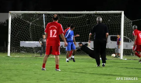Palestinian Prime Minister in Gaza Strip Ismail Haniyeh participate in a football match at al-Yarmouk stadium, marking the Traffic Day, in Gaza City on May 5, 2014. Photo by Mohammed Asad