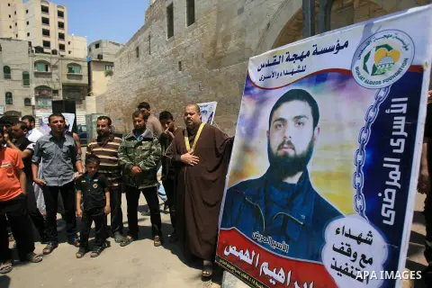 Palestinian supporters of Islamic Jihad movement take part in a demonstration in solidarity with Palestinian prisoners on hunger strike in Israeli jails, in Khan Younis in the southern Gaza Strip on May 9, 2014. Photo by...