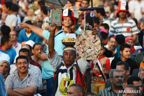 Egyptian supporters show placards with portraits of Egypt's former defense minister turned presidential candidate Abdel Fattah al-Sissi during a rally, in Cairo, Egypt, 10 May 2014. El-Sissi, is seen as the overwhelming...