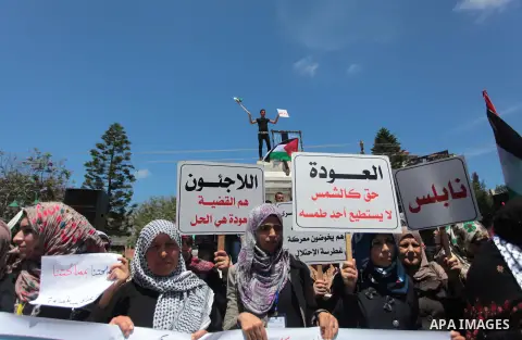 Palestinians participate in a rally marking the Nakba or the ''Day of Catastrophe'' in Gaza city, on May 13, 2014. Palestinians commemorate the ''Nakba,'' when hundreds of thousands fled or were expelled from their homes...