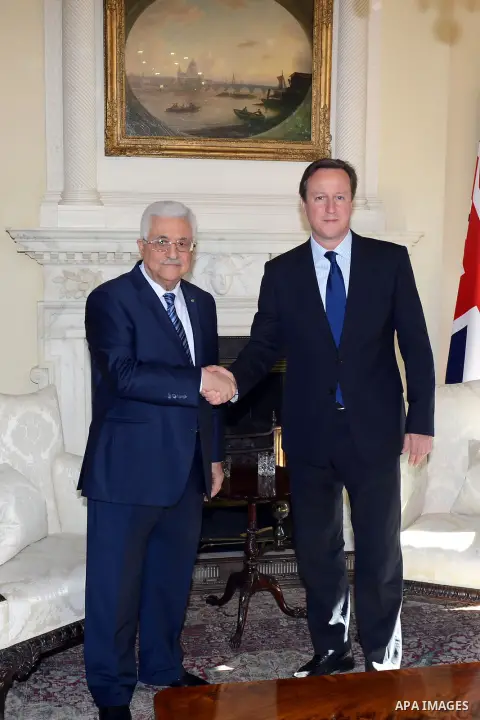 Palestinian President Mahmoud Abbas meets with British Prime Minister David Cameron at 10 Downing Street in London on May 14, 2014. Photo by Thaer Ganaim
