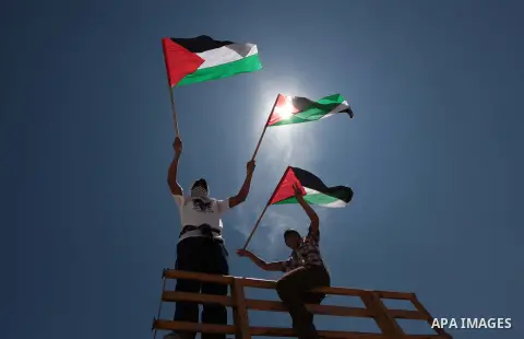 Palestinian protesters take part in a rally marking the Nakba or the ''Day of Catastrophe'' near Erez crossing in the northern Gaza Strip on May 15, 2014. Palestinians marked "Nakba" (Catastrophe) on Thursday to commemor...