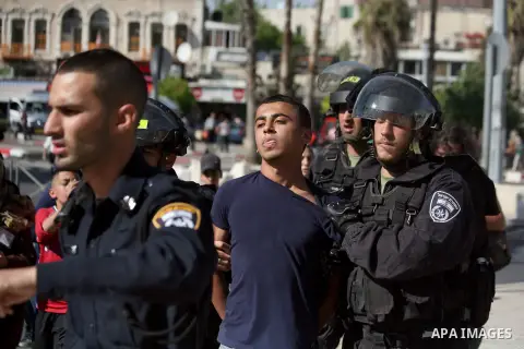 Israeli policemen detain a Palestinian protester during a demonstration marking the 66th anniversary of the "Nakba," meaning catastrophe, when many Palestinians fled or were expelled from their towns and villages during...