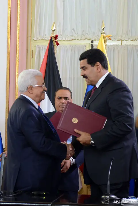 Venezuelan President, Nicolas Maduro, recieves from Palestine President, Mahmud Abbas the Palestine Star, maximun recognition that gives his country, in Miraflores Palace, in Caracas, Venezuela, on May 16, 2014. Mahmud A...