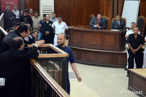 Egyptian Muslim Brotherhood preacher Safwat Hegazy talks to his judges during his trial in the capital Cairo on May 18, 2014. An Egyptian court today sentenced 126 supporters of ousted Islamist president Mohamed Morsi to...