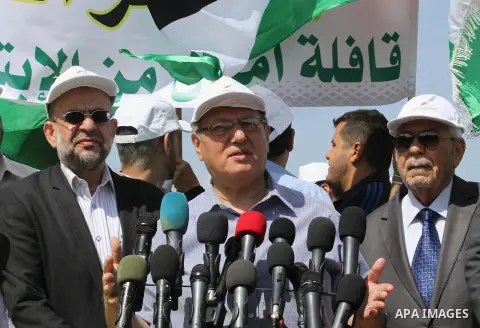 Palestinian deputy of the Legislative Council, Jamal al-khoudary, speaks during a protest against the blockade on Gaza, at the seaport of Gaza City May 19, 2014. Israel imposed a blockade on Gaza in 2007 after Islamist g...