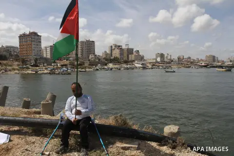 A Palestinian man takes part a protest against the blockade on Gaza, at the seaport of Gaza City May 19, 2014. Israel imposed a blockade on Gaza in 2007 after Islamist group Hamas seized control of the territory in a bri...