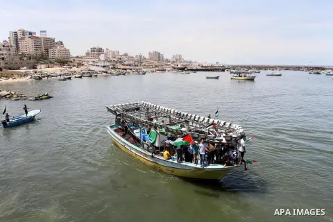 Palestinians sail their boats as part a protest against the blockade on Gaza, at the seaport of Gaza City May 19, 2014. Israel imposed a blockade on Gaza in 2007 after Islamist group Hamas seized control of the territory...