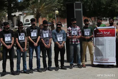 Palestinian youths take part a protest to solidarity with Palestinian prisoners on hunger strike in Israeli jails in Gaza City on May 19, 2014. Israel had refused to release as promised a last group of Palestinian prison...