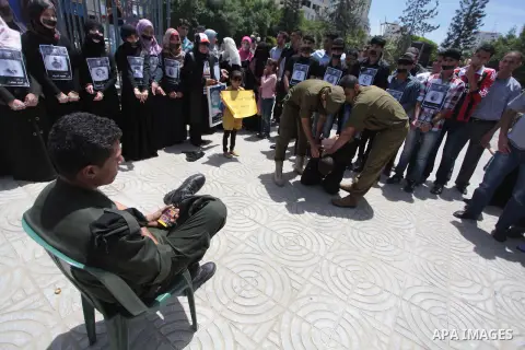 Palestinian youths take part a protest to solidarity with Palestinian prisoners on hunger strike in Israeli jails in Gaza City on May 19, 2014. Israel had refused to release as promised a last group of Palestinian prison...