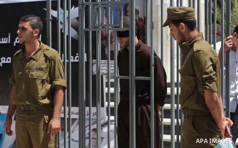 Palestinian youths take part a protest to solidarity with Palestinian prisoners on hunger strike in Israeli jails in Gaza City on May 19, 2014. Israel had refused to release as promised a last group of Palestinian prison...