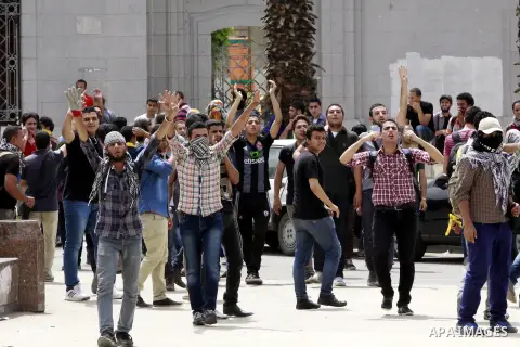 Egyptian supporters of ousted President Mohammed Morsi chant slogans during a demonstration outside Cairo University in Giza, near Cairo, May 20, 2014. Students who took their protest outside the campus Wednesday clashed...