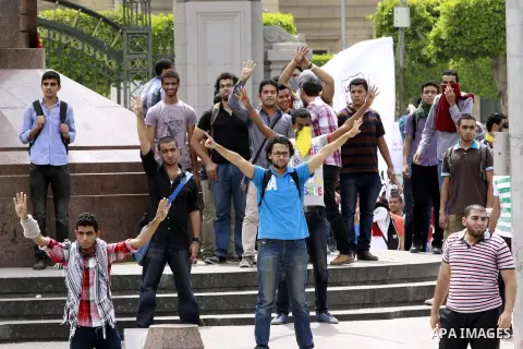 Egyptian supporters of ousted President Mohammed Morsi chant slogans during a demonstration outside Cairo University in Giza, near Cairo, May 20, 2014. Students who took their protest outside the campus Wednesday clashed...