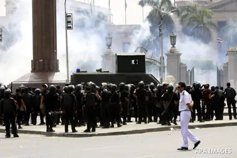 Egyptian security forces fire tear gas towards supporters of ousted President Mohammed Morsi during a demonstration outside Cairo University in Giza, near Cairo, May 20, 2014. Security forces used tear gas to disperse st...