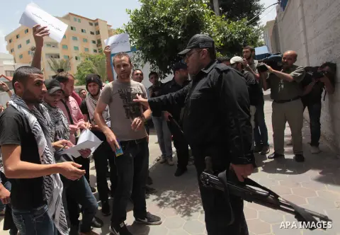 Palestinian youths take part a protest during a rally in Gaza City on May 21, 2014 to express solidarity with Palestinian prisoners on hunger strike in Israeli jails. In late March, Israel had refused to release as promi...