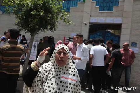 Palestinian youths take part a protest during a rally in Gaza City on May 21, 2014 to express solidarity with Palestinian prisoners on hunger strike in Israeli jails. In late March, Israel had refused to release as promi...