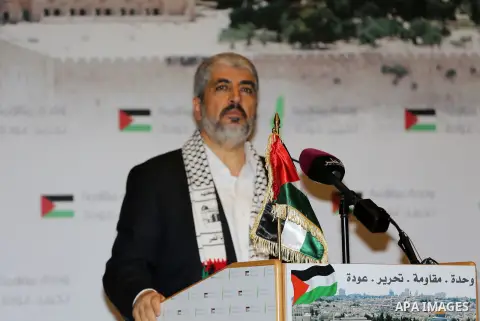 Palestinian political leader of the Hamas movement, Khaled Meshaal, speaks during a ceremony to mark "Nakba", the annual commemoration of what Palestinians term the catastrophe in Doha, Qatar, May 20, 2014. Meshaal said...