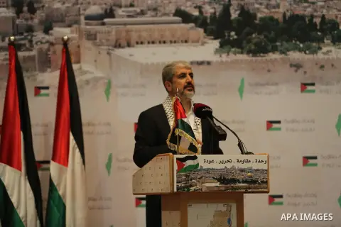 Palestinian political leader of the Hamas movement, Khaled Meshaal, speaks during a ceremony to mark "Nakba", the annual commemoration of what Palestinians term the catastrophe in Doha, Qatar, May 20, 2014. Meshaal said...