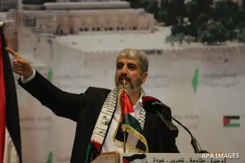 Palestinian political leader of the Hamas movement, Khaled Meshaal, speaks during a ceremony to mark "Nakba", the annual commemoration of what Palestinians term the catastrophe in Doha, Qatar, May 20, 2014. Meshaal said...