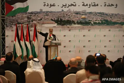 Palestinian political leader of the Hamas movement, Khaled Meshaal, speaks during a ceremony to mark "Nakba", the annual commemoration of what Palestinians term the catastrophe in Doha, Qatar, May 20, 2014. Meshaal said...