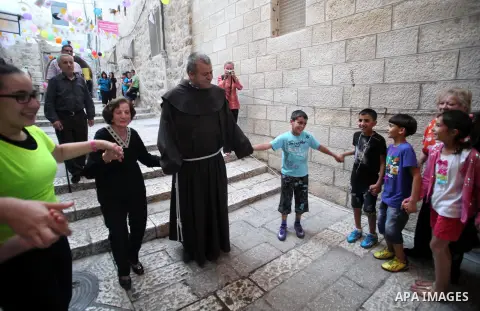 Palestinian Christian celebrate in Jerusalem's Old City on May 21, 2014 a few days ahead of the top-level visit by Pope Francis to the Holy Land. The Pope will visit Gethsemane during his first trip to the region, visiti...