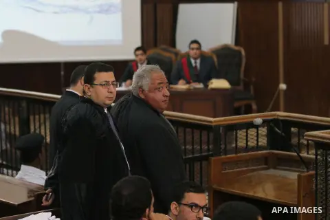 Members of defense authority of defendants in the Marriott terror cell case attend the trial in Cairo on May 22, 2014. A total of 20 defendants in the case are charged with harming Egypt's national interests by spreading...