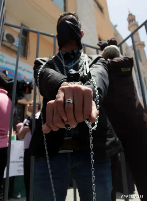Palestinian journalists take part a protest during a rally in Gaza City on May 22, 2014 to express solidarity with Palestinian prisoners on hunger strike in Israeli jails. In late March, Israel had refused to release as...