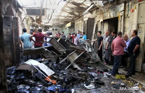 Palestinians clean up debris following an explosion on May 22, 2014 at a shop in the old part of the West Bank city of Nablus. The explosion of unknown origin damaged several shops and let one person seriously injured. P...