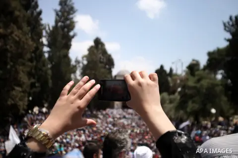 Palestinian supporters of Hizbut Tahrir, a conservative Islamic group shouts slogans during a rally to mark the 93rd anniversary of the overthrow of the Islamic Caliphate, following Friday prayer at al-Aqsa mosque compou...