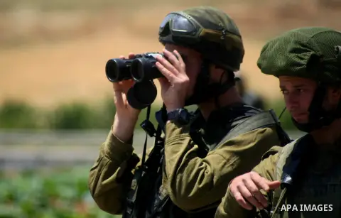 Palestinian protesters clash with Israeli soldiers during a protest to solidarity with Palestinian prisoners held in Israeli jails in the West Bank refugee camp of al-Fawwar near Hebron on May 24, 2014. Some 120 Palestin...