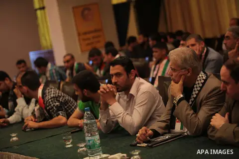 Palestinian attend a conference of the Islamic radios union, in Gaza city, on May 25, 2014. Photo by Ashraf Amra